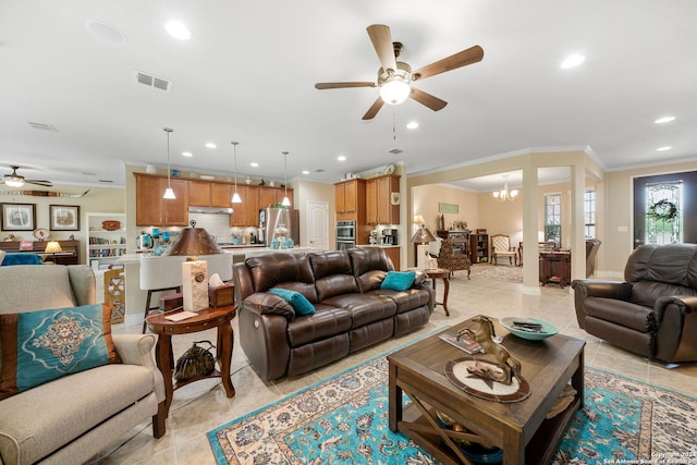 tiled living room with ornamental molding and ceiling fan with notable chandelier