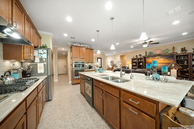 kitchen featuring a kitchen island with sink, ornamental molding, pendant lighting, ceiling fan, and sink