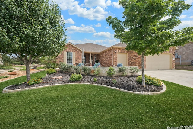 view of front facade with a front yard and a garage