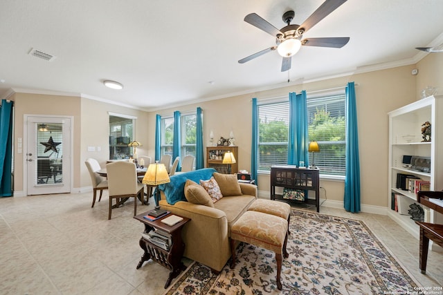 living room with ceiling fan and ornamental molding