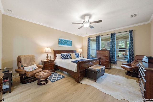 bedroom featuring ornamental molding, ceiling fan, and light hardwood / wood-style flooring