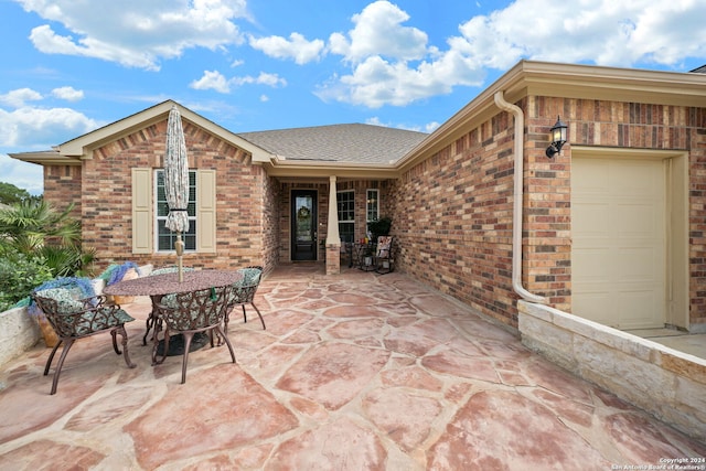 view of patio / terrace featuring a garage