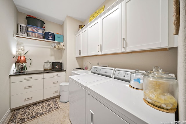 laundry area featuring sink, cabinets, washer and clothes dryer, and light tile patterned flooring