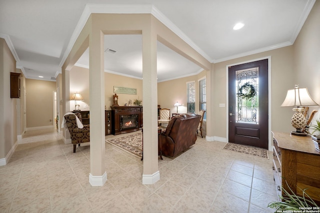 foyer entrance featuring light tile patterned flooring and ornamental molding