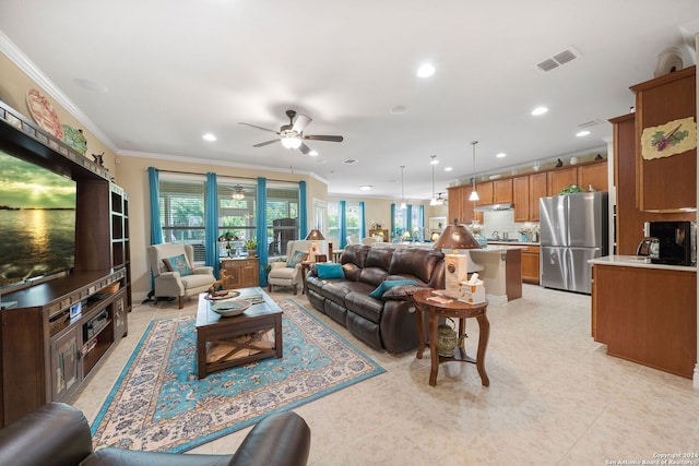 living room featuring ceiling fan and ornamental molding