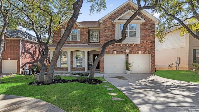 view of front of house with a garage and a front lawn