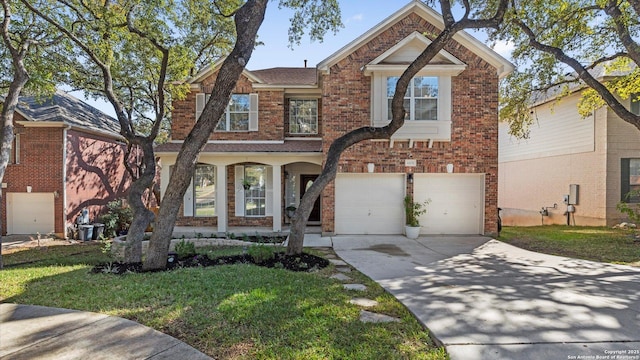 front facade featuring a front yard and a garage