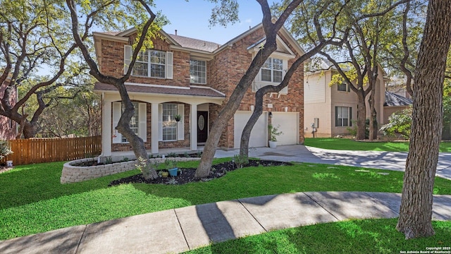 view of front facade featuring a front yard and a garage