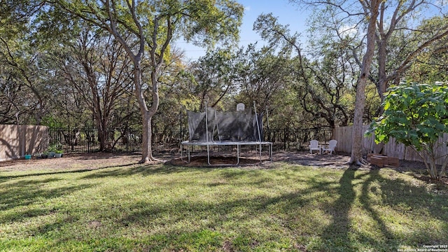 view of yard featuring a trampoline