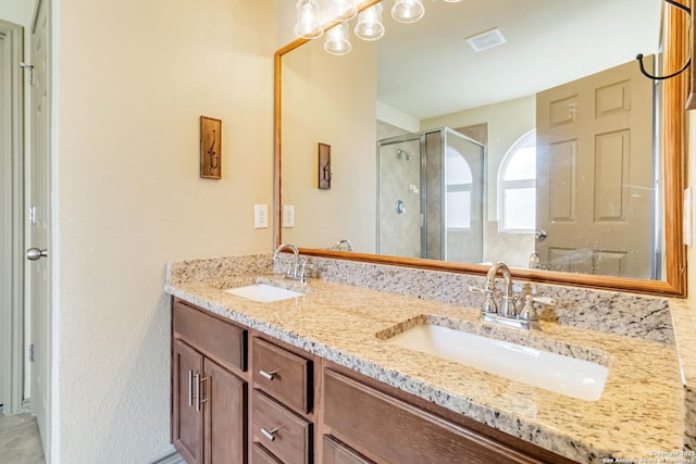 bathroom featuring vanity and walk in shower