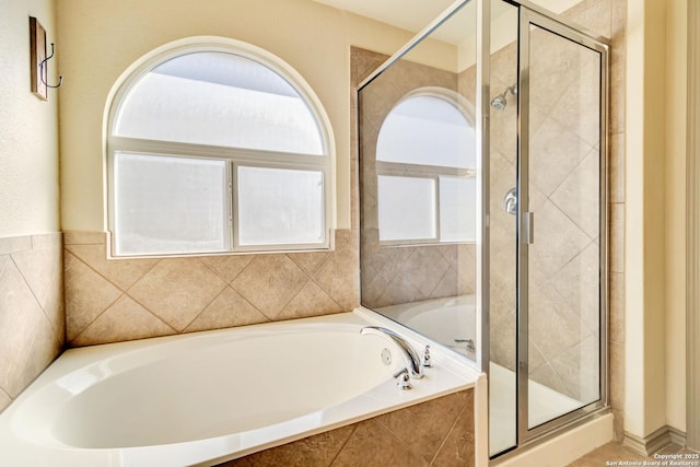 bathroom with independent shower and bath