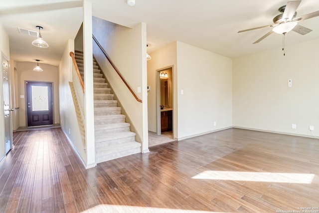 foyer with hardwood / wood-style flooring and ceiling fan