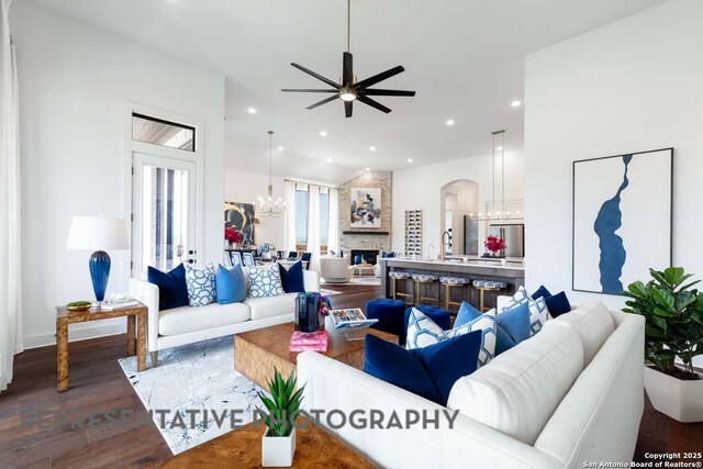 435 Nash, New Braunfels, TX 78130 - living room featuring hardwood / wood-style flooring, ceiling fan with notable chandelier, and a fireplace