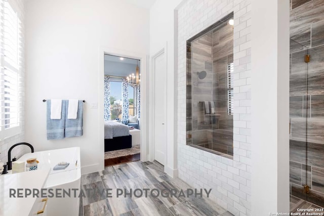 435 Nash, New Braunfels, TX 78130 - bathroom featuring a notable chandelier and a shower with door