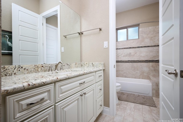 bathroom featuring toilet and vanity