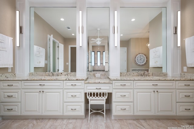 bathroom featuring vanity and ceiling fan