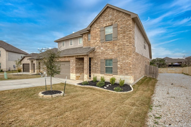 view of front of home with a front lawn and a garage