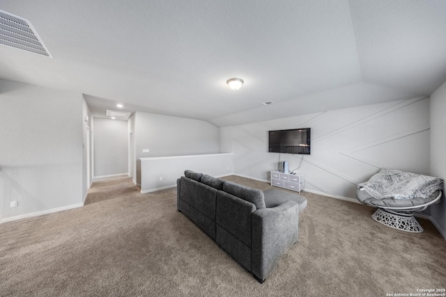 living room featuring lofted ceiling and carpet flooring