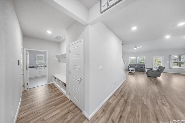 hallway with light wood-type flooring