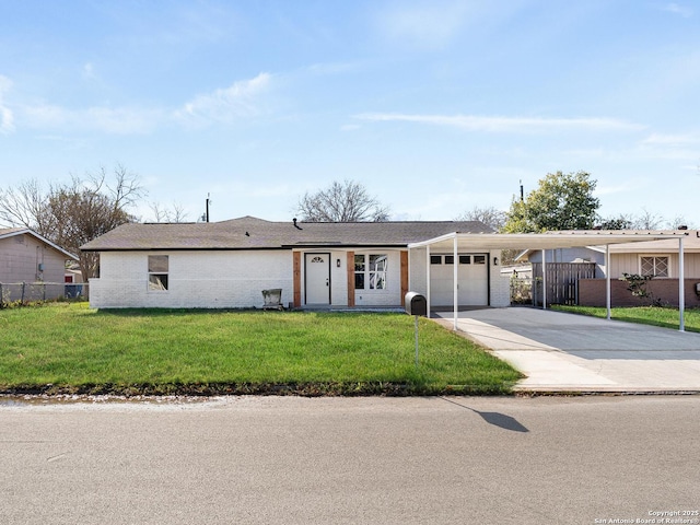 ranch-style home with a carport, a front yard, and a garage