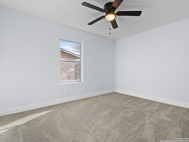 carpeted empty room featuring ceiling fan