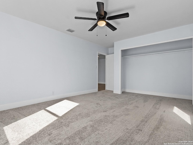 unfurnished bedroom with carpet flooring, a closet, and ceiling fan