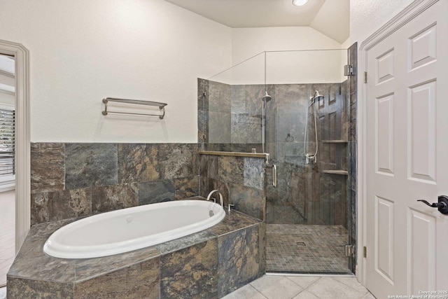 bathroom featuring lofted ceiling, tile patterned floors, and separate shower and tub