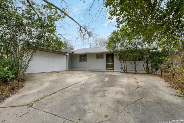 single story home with a garage