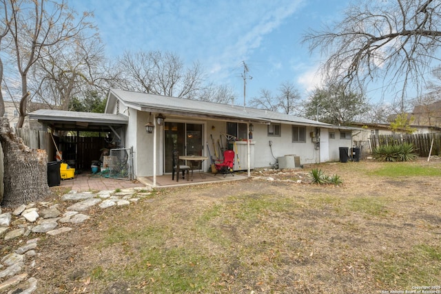 rear view of house with a lawn