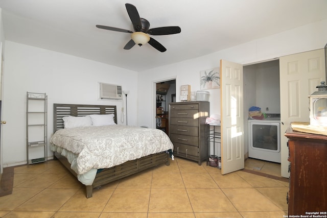 bedroom with ceiling fan, a spacious closet, washer / dryer, and light tile patterned flooring