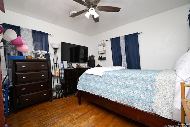 bedroom with ceiling fan and hardwood / wood-style flooring