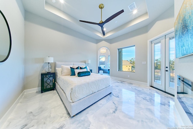 bedroom with french doors, access to exterior, ceiling fan, and a tray ceiling