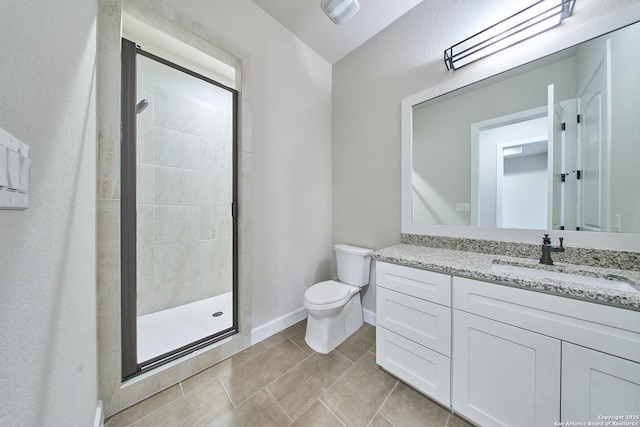 bathroom featuring lofted ceiling, an enclosed shower, vanity, and toilet