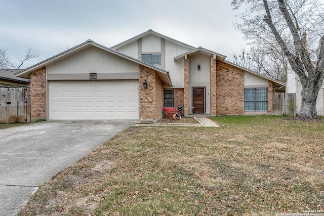 front of property featuring a front lawn and a garage