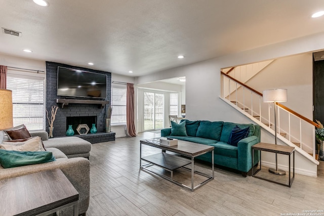 living room featuring a fireplace