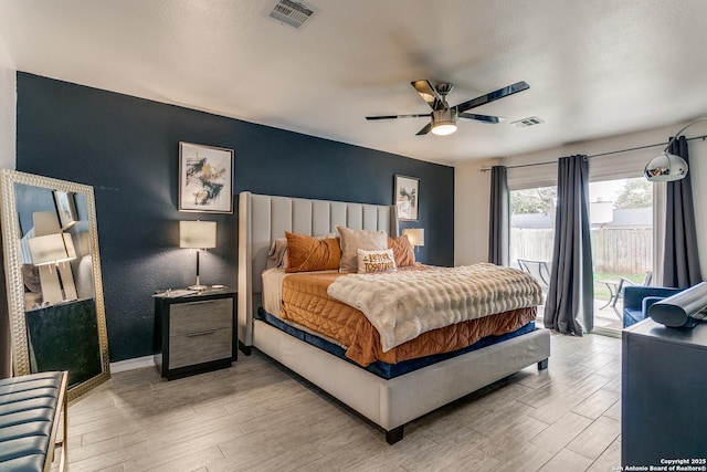 bedroom with ceiling fan and access to exterior