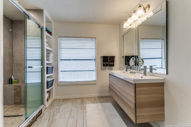 bathroom with vanity and a shower with shower door