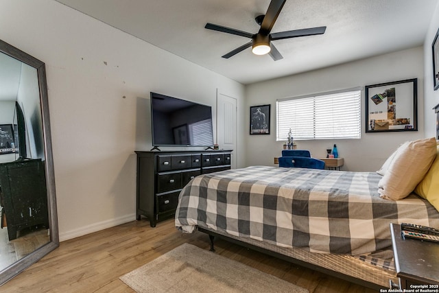 bedroom featuring ceiling fan and light hardwood / wood-style flooring