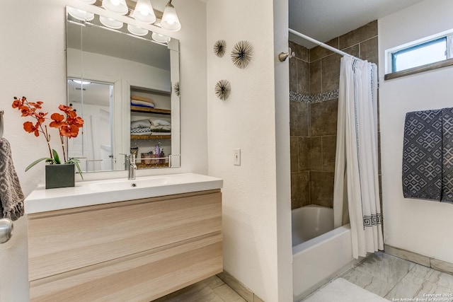 bathroom featuring shower / tub combo and vanity