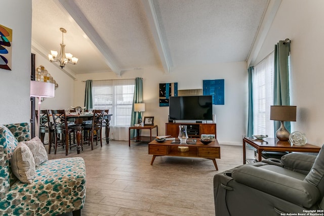 living room featuring a textured ceiling, a notable chandelier, light hardwood / wood-style floors, and vaulted ceiling with beams