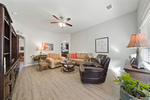 living room with ceiling fan and light hardwood / wood-style floors