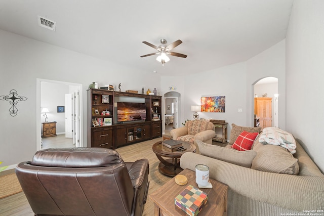 living room featuring ceiling fan and light hardwood / wood-style flooring