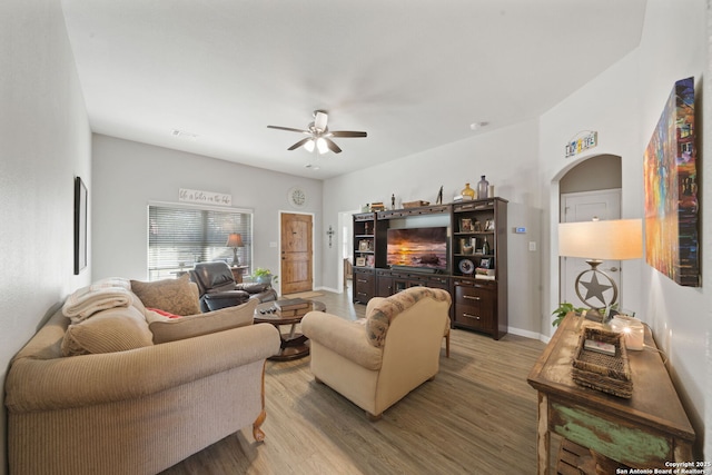 living room featuring hardwood / wood-style flooring and ceiling fan