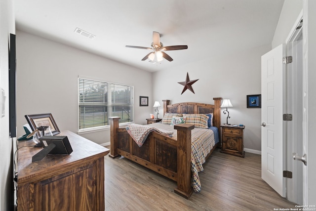 bedroom featuring ceiling fan and wood-type flooring