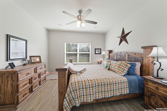 bedroom featuring ceiling fan and light hardwood / wood-style floors