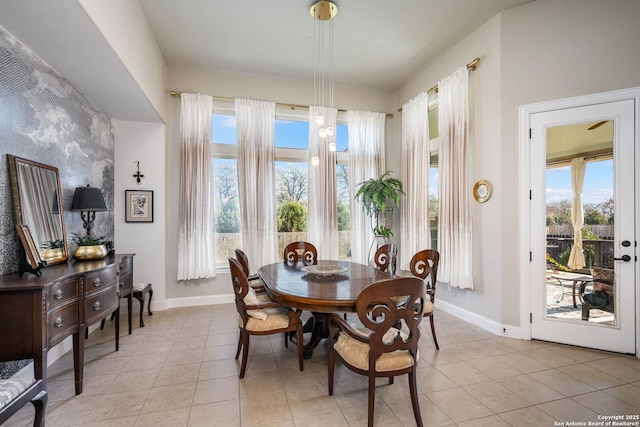 tiled dining room with a wealth of natural light