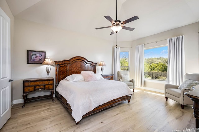 bedroom featuring lofted ceiling, ceiling fan, and light hardwood / wood-style floors