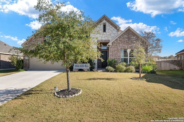 view of front of house featuring a front yard and a garage