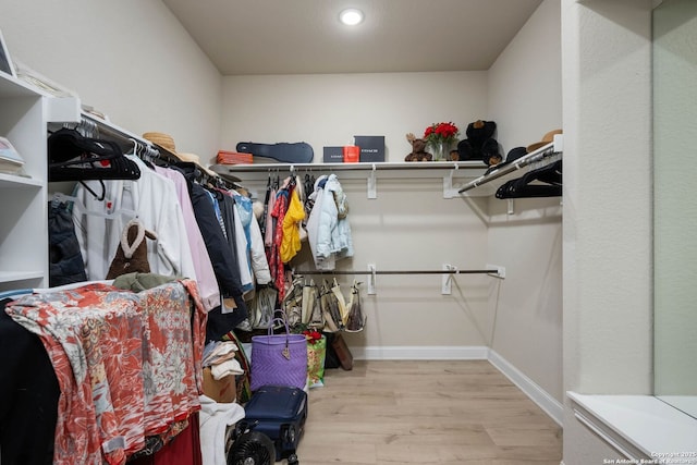 walk in closet featuring light wood-type flooring