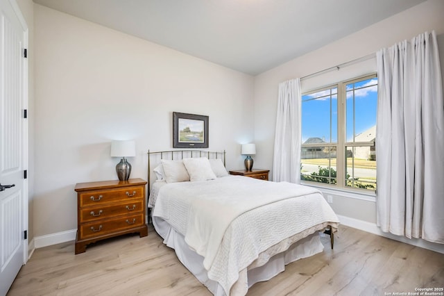 bedroom featuring light hardwood / wood-style floors